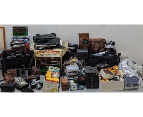 A large lot of cameras and camera accessories to include Sankyo Sound XL-320 Supertronic, Halina 35X, Kowa, Kodak, Polaroid a