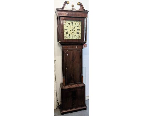 An early 19th century mahogany longcase clock, the case having a gilt metal ball finial, string inlaid and two reeded columns