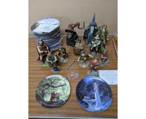 A group of Simon Laurens models Lord of the Rings composite resin figurines, studio pottery Wizard figures, and others, along