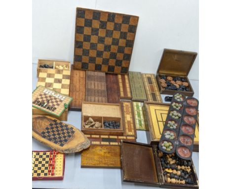 A collection of Cribbage boards together with a chess board and chess pieces together with a Mancala boardLocation:A3F 
