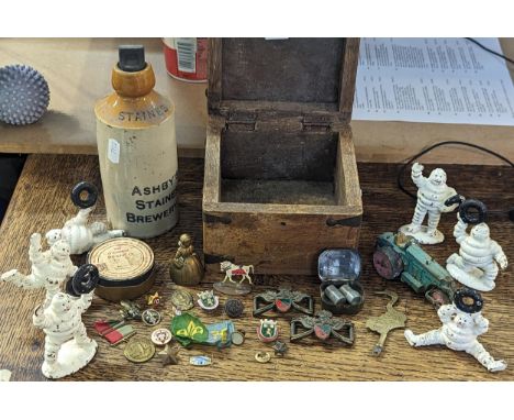 Mixed collectables to include six cast iron Michelin men figures in various poses, vintage toy tractor, mixed bottoms and dup