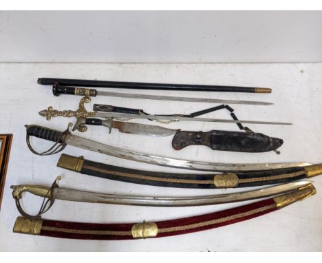 Two Indian reproduction swords, a foil, a replica style sword, an early 20th century sword stick and a sheath knife, Location