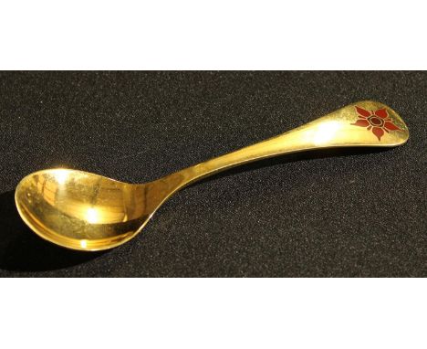 Georg Jensen - a Danish silver-gilt and enamel spoon, oval dotted mark 