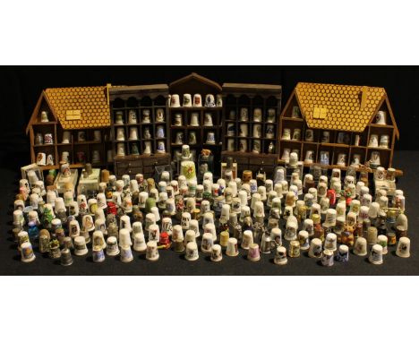 A quantity of ceramic and other thimbles including Royal Crown Derby, Wedgwood, Coalport, Royal Doulton, Spode, Caverswall, e