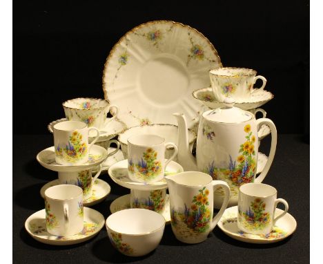 A 1930s Foley China coffee set for six, printed with summer gardens, coffee pot, six coffee cans and saucers, cream jug, suga