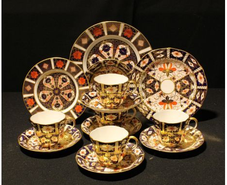 A Royal Crown Derby 1128 pattern plate, 21.5cm diameter, first quality; another, 16cm; five 2451 pattern cups and saucers; a 