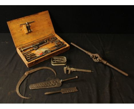 A Peter Stubs screw plate; a wire gauge; other engineering tools including tap and die, Vernier gauge, calipers etc.Provenanc