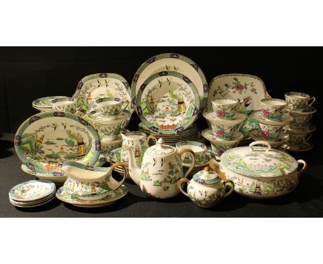 A Crown Staffordshire Chinese Willow pattern part dinner and tea service comprising dinner plates, salad plates, dessert bowl