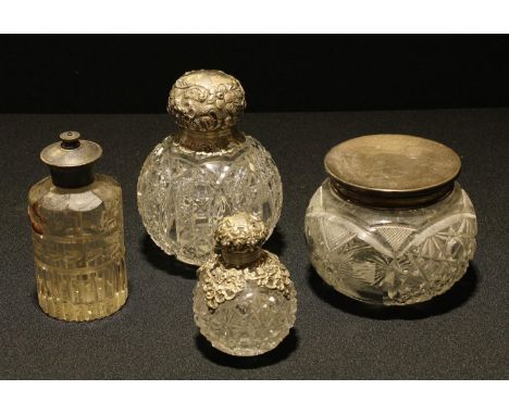 A Victorian silver topped dressing table scent bottle, London 1895, 13.5cm high; a dressing table jar with silver cover, Shef