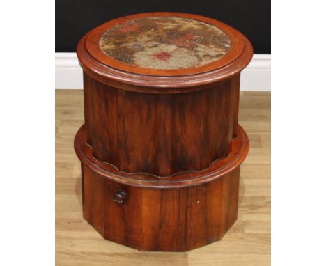 A Victorian mahogany circular pedestal boudoir commode, hinged seat with inset needlework panel, enclosing a further seat and