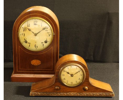 An early 20th century American dome-top mantel timepiece, the case fashioned in the Edwardian taste with an oval batwing pate