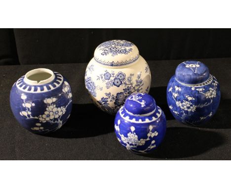 A Chinese ginger jar and cover, prunus on blue cracked ice ground, 12cm high; others smaller; a Mason's willow pattern ginger