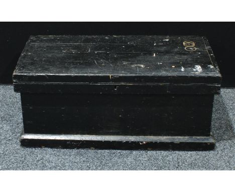 A pine and painted carpenter's tool chest, hinged cover enclosing three sliding trays, skirted base, 40cm high, 92cm wide, 46