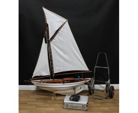 A Marina Modelling 1:12th scale scratch built radio controlled sailing yacht, 130cm long, presented with stand, transportatio