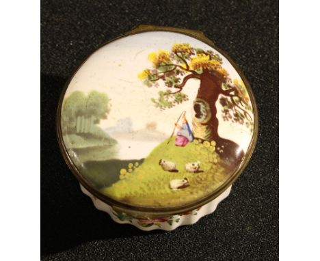 A George III South Staffordshire enamel circular snuff box, hinged cover painted with a shepherd tending the flock, fluted ba