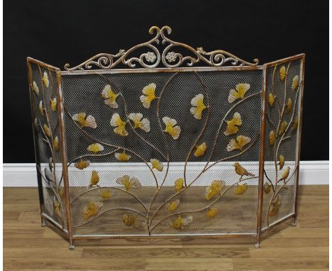 An Art Nouveau style wirework firescreen, scrolling foliate cresting, the panels applied with birds perched amongst trailing 