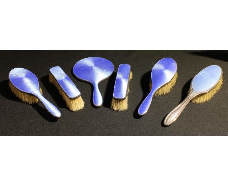 A silver and enamel five piece vanity set, Birmingham 1925; another, brush (6) 