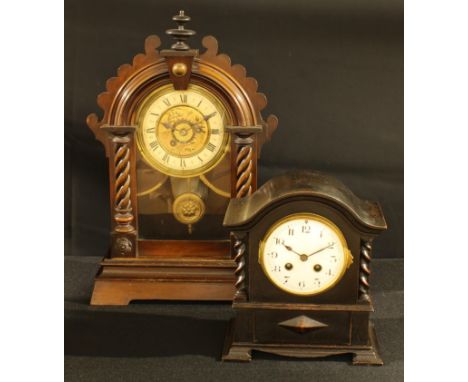 An early 20th century architectural mantel alarm clock, 46cm high; an oak cased mantel timepiece, 10.5cm circular enamel dial