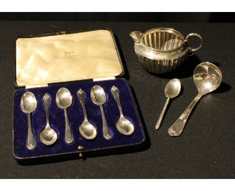 A silver cream jug, Chester 1896; a set of six silver teaspoons, cased, Sheffield 1938; a sauce ladle, Sheffield 1996; a teas