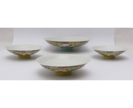 A set of three Chinese porcelain famille jaune dishes - first half 20th century, of shallow cupped form with a circular foot,