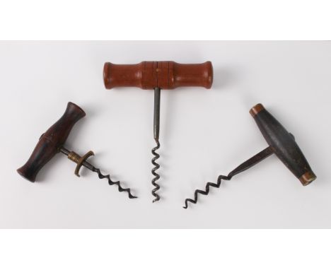 Two antique corkscrews - one with turned rosewood handle, brass collar and speed worm helix, 11.4 cm long; the other with tur