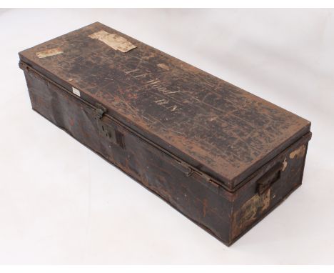 An early 20th century tin uniform trunk - the japanned exterior with remnants of travel labels and painted with the owner's n