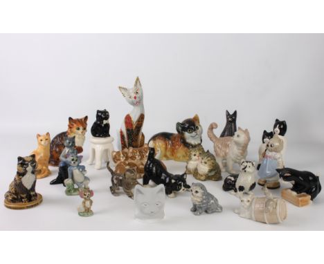 A collection of porcelain, china and other figures of cats and kittens - including examples by Wade, John Beswick, Sylvac and