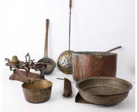 Seven pieces of copper and brass ware: a large copper and wrought iron 30 cm sauce pan;  a smaller 15.5 cm brass and wrought 