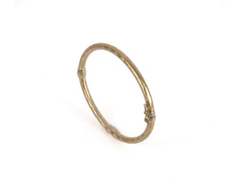 An Italian 9ct two-colour gold hinged bangle - marked 'Italy 9Kt', internal size 6.1 x 5.1 cm.&nbsp;