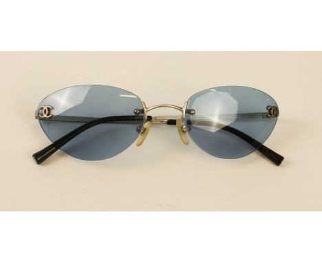 A pair of cased Chanel lady's sunglasses - ref. 4003 c103/72, with blue-tinted rimless lenses and silver frames, with origina