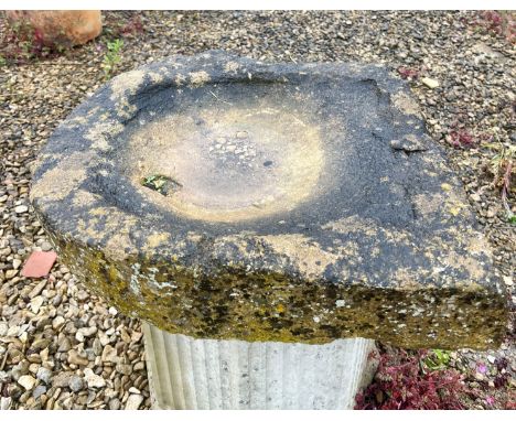 A Cotswold stone shallow trough or bird bath - one end slightly V-shaped, 54 x 51cm, 10cm high.