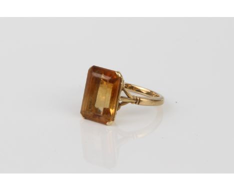 An 18ct yellow gold and yellow stone ring - unmarked, tests as 18ct gold, probably yellow sapphire, with stronger colour zoni