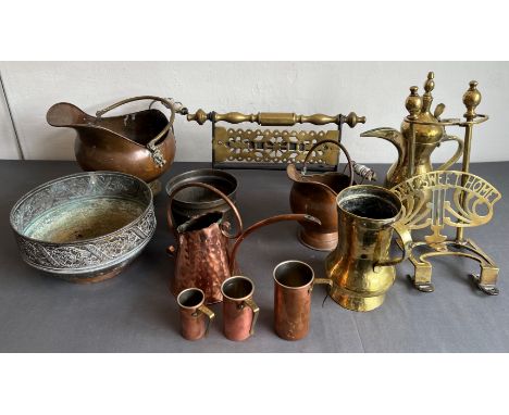 Ten pieces of copper and brass ware: a Turkish brass Dallah and similar brass tankard;  a nested set of three copper cup-meas