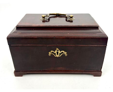 A George III mahogany sarcophagus tea caddy - with original brass handle and pierced escutcheon, on bracket feet. (LWH 24 x 1