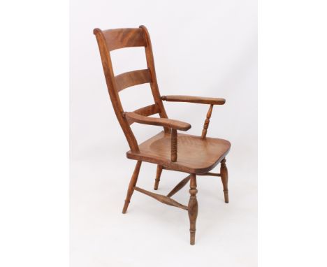 A beech and elm ladder back armchair - c.1900, the back with three graduated rails over a saddle seat and swept arms on bobbi