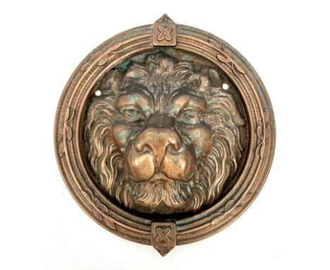 A large 19th century style brass lion mask door knocker - second half 20th century, with bronzed patination and foliate decor