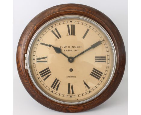 A Garrard oak cased 30 hour wall clock - 1920s-30s, with painted Roman dial, signed 'F. W. Ginger Banbury Garrard', fronting 