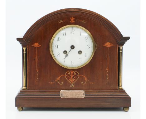An early 20th century mahogany and marquetry cased mantel clock - the arched case with marquetry decoration flanked by two sl