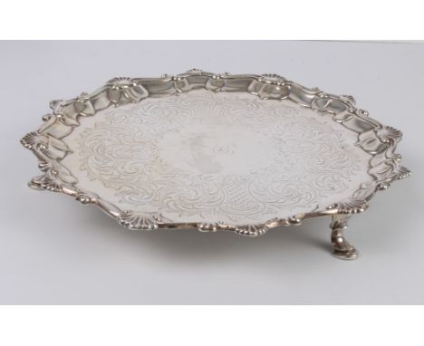 A George III silver salver - maker's mark IC, probably John Carter II, London 1768, with shell and scroll rim, engraved folia