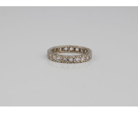 A 9ct white gold full eternity ring - hallmarked London 2004, with 21 round cut white stones, size K/L. 