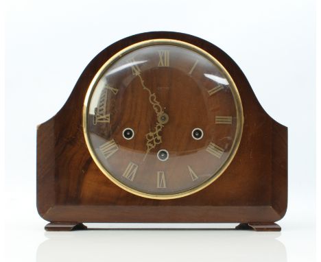 A walnut-cased Smiths mantel clock - 1940 or 1950s, the walnut dial with applied brass Roman numerals, three train quarter st