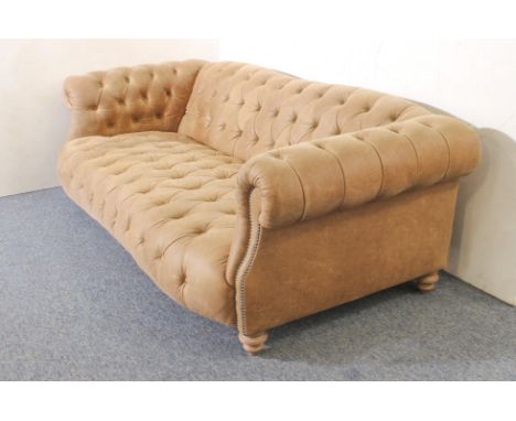 A leather Chesterfield three-seater sofa - modern, in soft pale-brown grained leather, raised on turned wooden feet, in good 