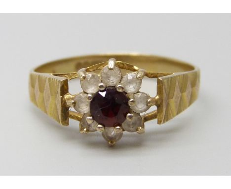 A 9ct gold, garnet and white stone cluster ring, 1.5g, K
