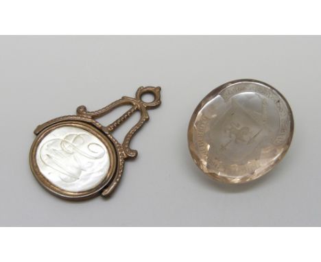Two seals - a quartz stone with intaglio crest, and a spinning fob with portrait and monogram, 4.5cm