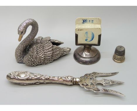 A silver covered model of a swan, hallmarked and stamped 'filled', a white metal propelling pencil set with a bloodstone, a s