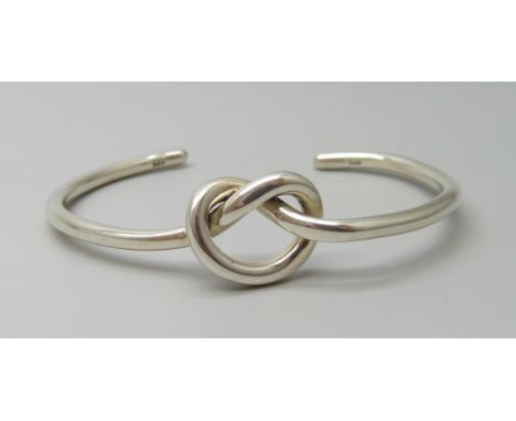 A silver knot torc bangle, 15.8g, 6cm diameter