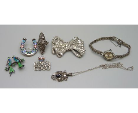 A collection of vintage jewellery including a silver marcasite set watch, a silver and enamel bird brooch, and a paste set du