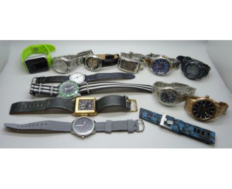 A collection of wristwatches including Armani Exchange, Timex, Police, Pulsar, etc.
