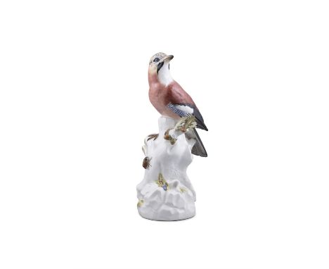 A 20TH CENTURY MEISSEN PAINTED PORCELAIN MODEL OF A JAY BIRD standing on a the stump of an oak tree, with climbing beatle, un