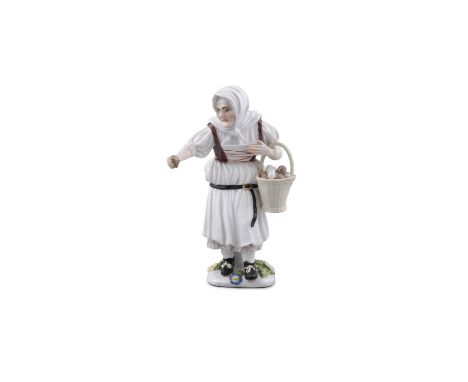 A 19TH CENTURY MEISSEN PAINTED PORCELAIN FIGURE OF A PEASANT WOMEN SELLING PEARS,with basket, on a shaped square base, model 